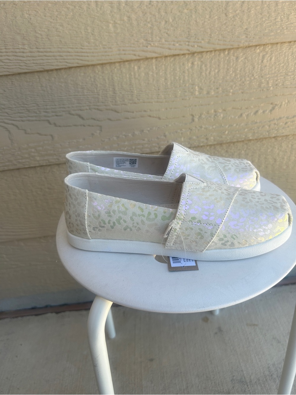 Toms Kids Slip-On Sneakers in Iridescent Cream with Subtle Leopard Print